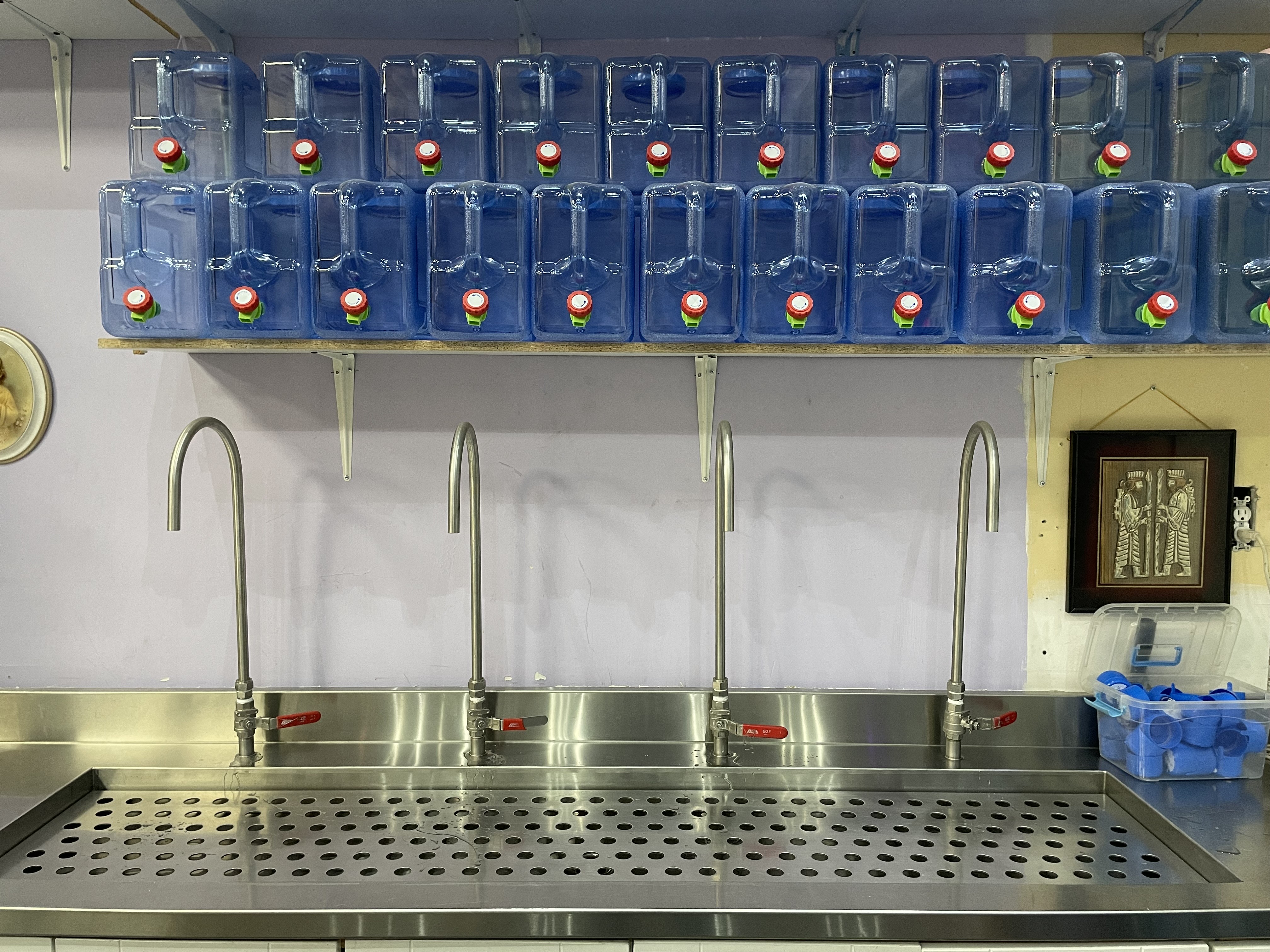 Floor-standing dispensers with water bottles